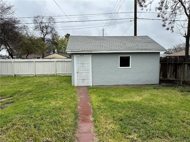 view of outbuilding featuring an outdoor structure and a fenced backyard