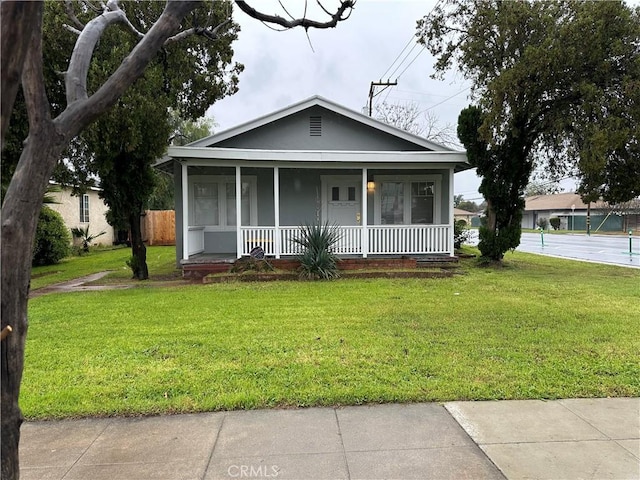 view of front facade with a porch and a front yard