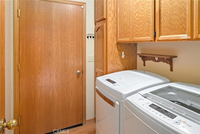 laundry area featuring cabinet space and washer and dryer