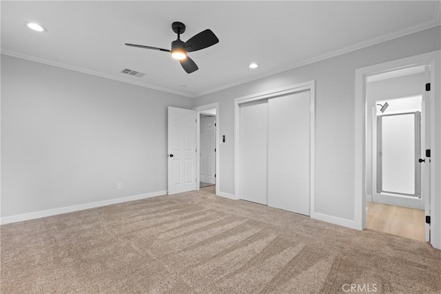 unfurnished bedroom with recessed lighting, visible vents, carpet flooring, and ornamental molding