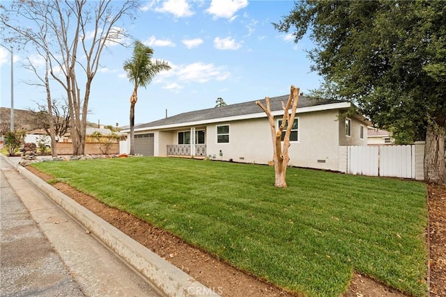 view of front of house featuring a garage, crawl space, fence, a front lawn, and stucco siding