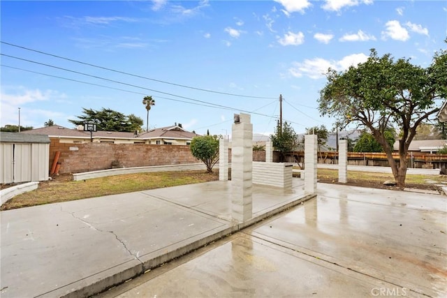 exterior space with a patio area and a fenced backyard