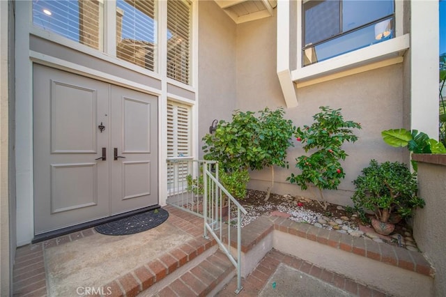 doorway to property with stucco siding