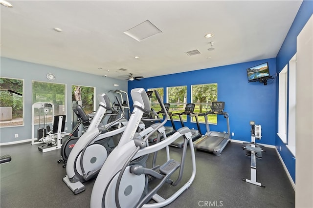 workout area with a healthy amount of sunlight, baseboards, visible vents, and recessed lighting