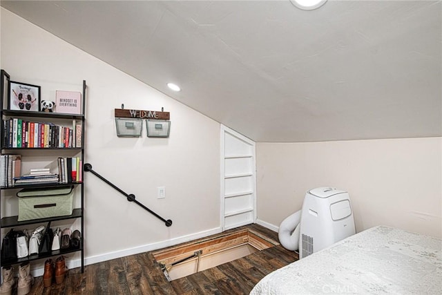 bedroom featuring lofted ceiling, recessed lighting, wood finished floors, and baseboards