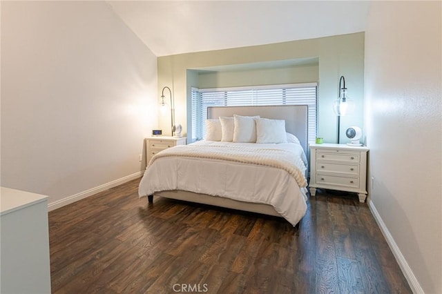 bedroom featuring vaulted ceiling, dark wood finished floors, and baseboards