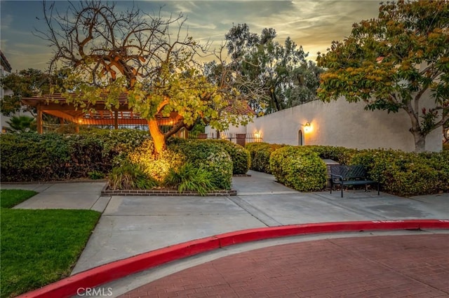 view of property's community featuring a patio and fence