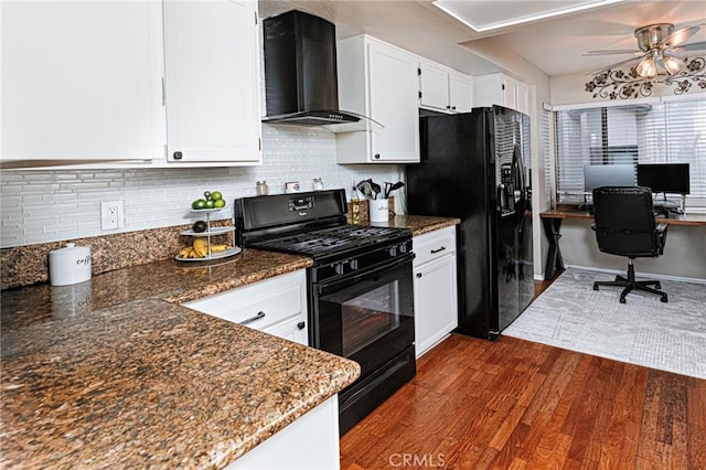 kitchen with black appliances, wall chimney range hood, white cabinetry, and dark wood-type flooring