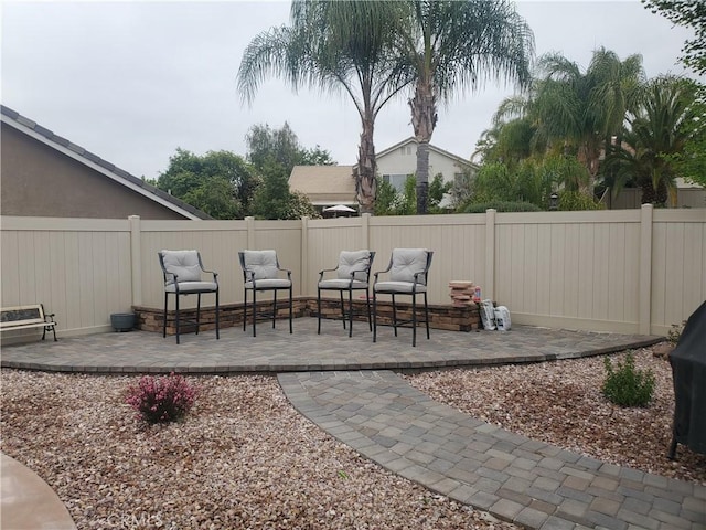 view of patio featuring a fenced backyard