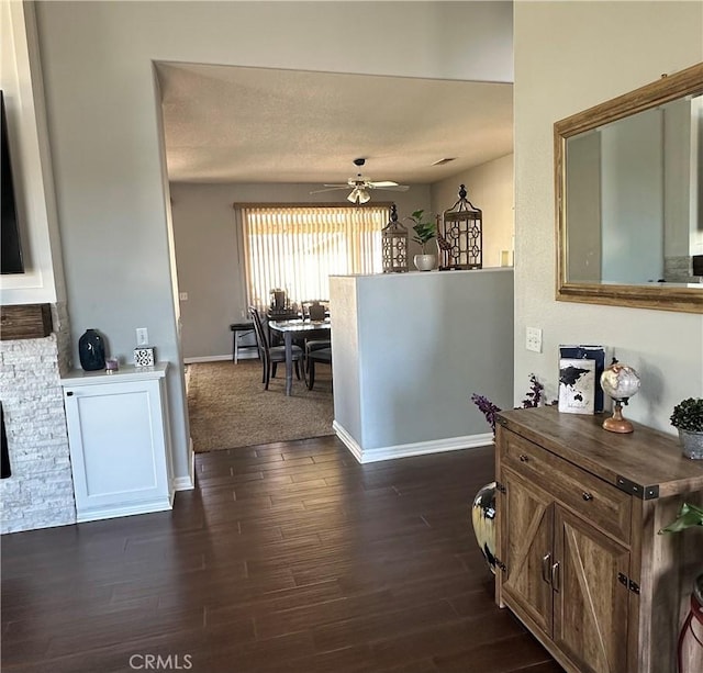 interior space with dark wood-style floors and baseboards