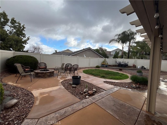 view of patio / terrace featuring a fire pit and a fenced backyard