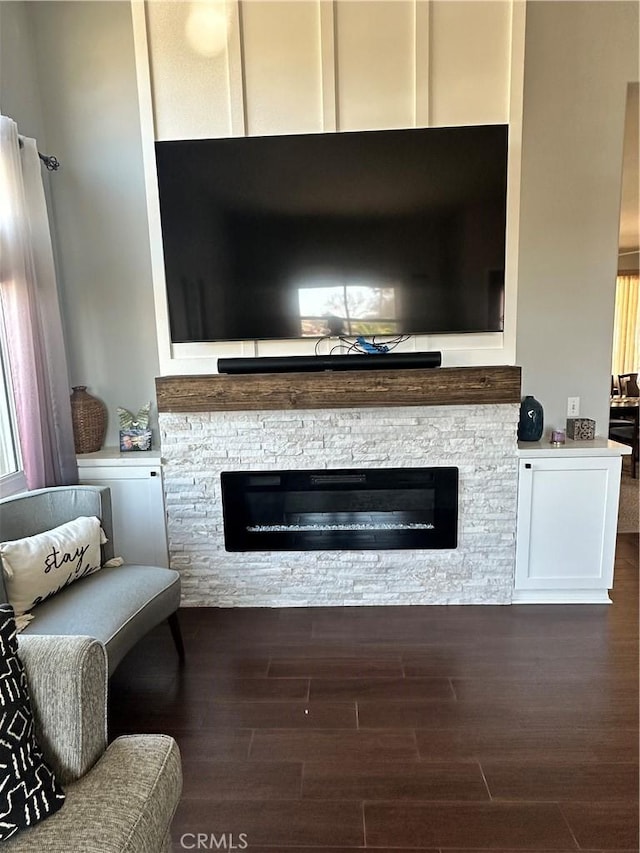 room details with wood finished floors and a fireplace