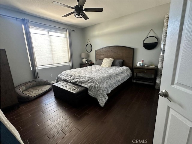 bedroom with dark wood finished floors and a ceiling fan