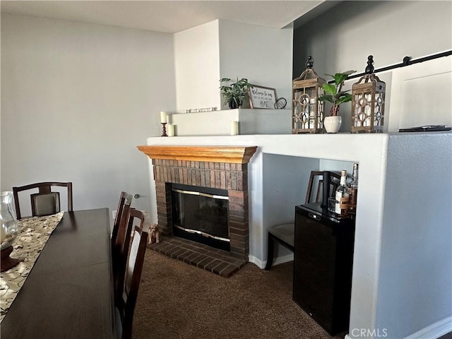 carpeted dining space with a fireplace