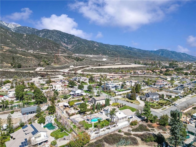 birds eye view of property with a residential view and a mountain view