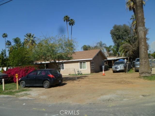 single story home featuring stucco siding