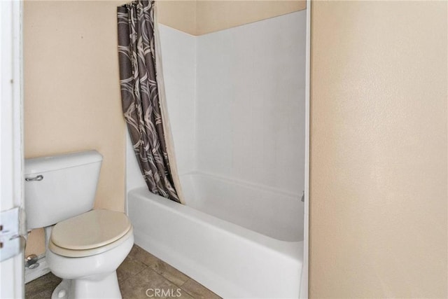 full bathroom with toilet, tile patterned flooring, and shower / bath combo