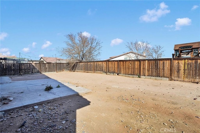 view of yard featuring a patio area and a fenced backyard