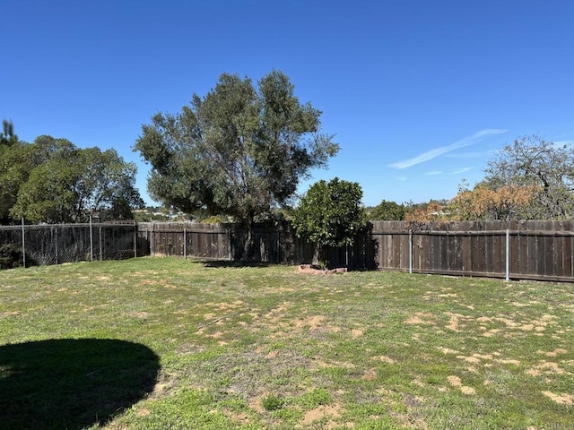 view of yard featuring a fenced backyard