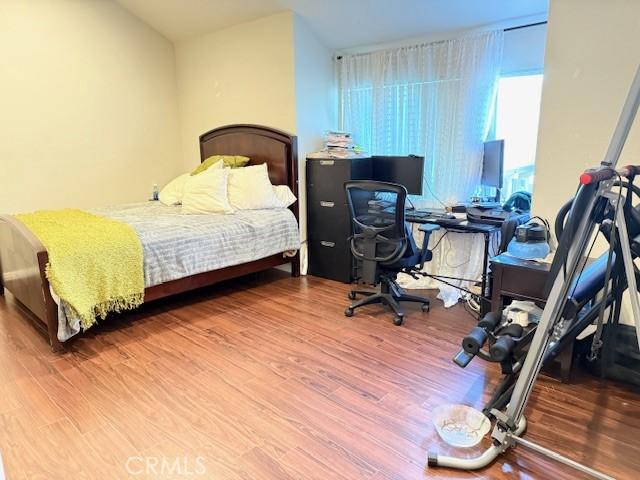 bedroom featuring wood finished floors