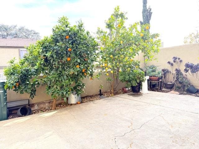 view of patio featuring fence