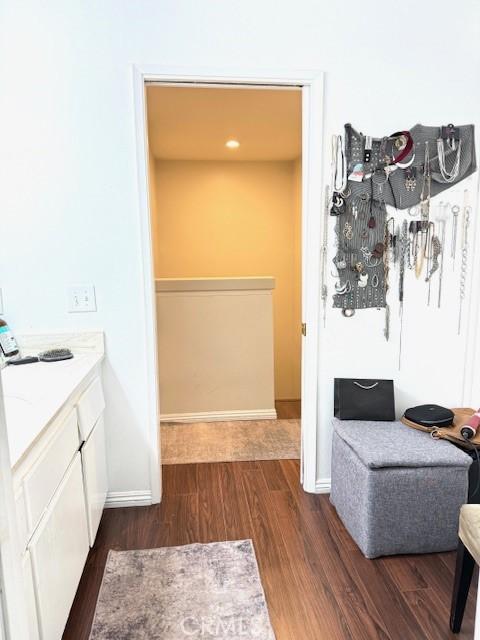 bathroom featuring baseboards and wood finished floors