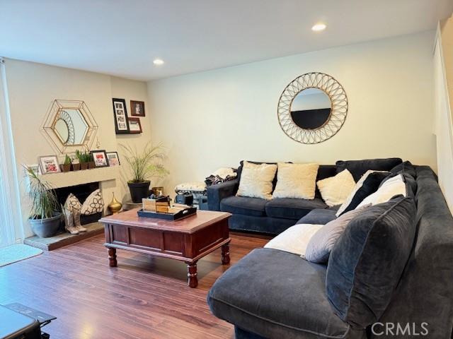 living area featuring recessed lighting and wood finished floors