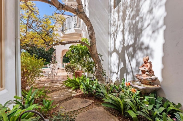 view of yard with a balcony and a patio area