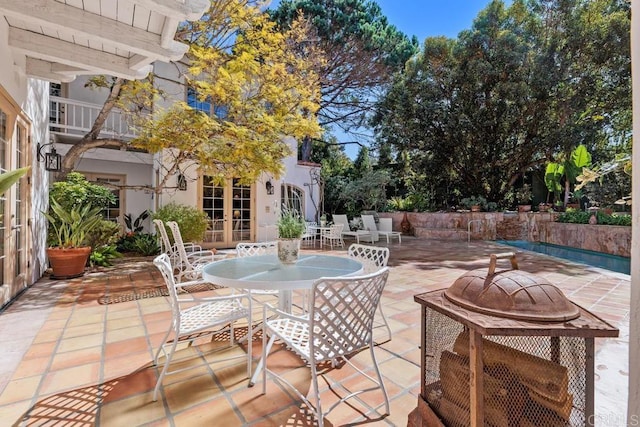 view of patio / terrace featuring french doors and outdoor dining area