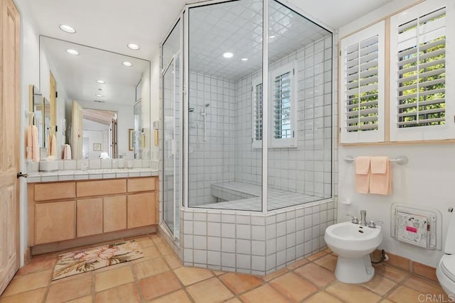 bathroom with toilet, a stall shower, recessed lighting, a bidet, and vanity