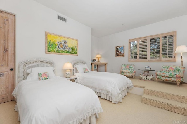 bedroom featuring carpet flooring and visible vents