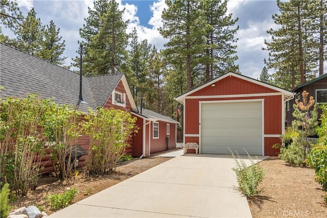 detached garage featuring driveway