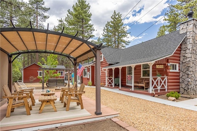 view of patio with an outbuilding and a shed