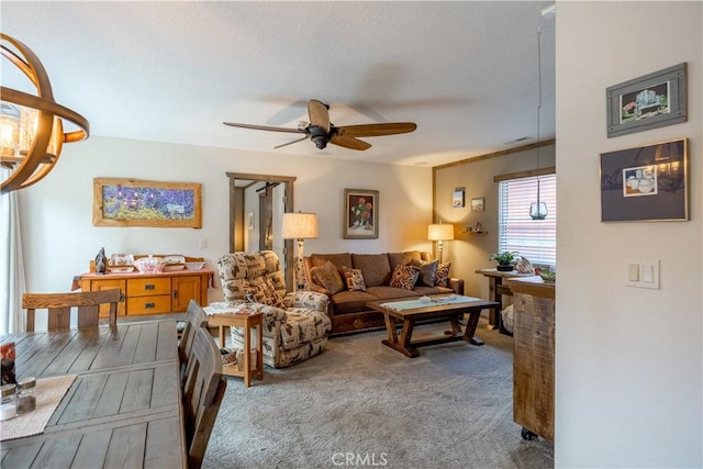 living room featuring ceiling fan and wood finished floors