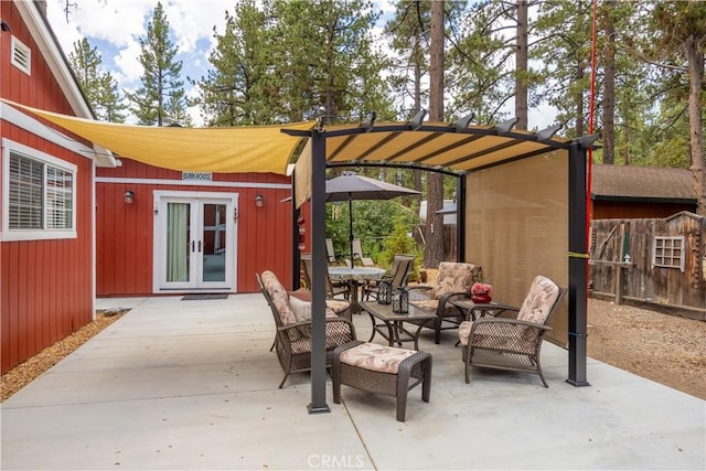 view of patio featuring fence and a pergola