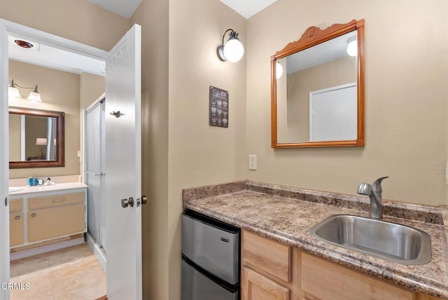 bathroom with vanity and tile patterned floors