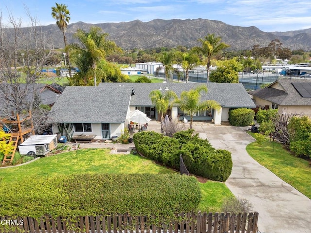 birds eye view of property with a mountain view