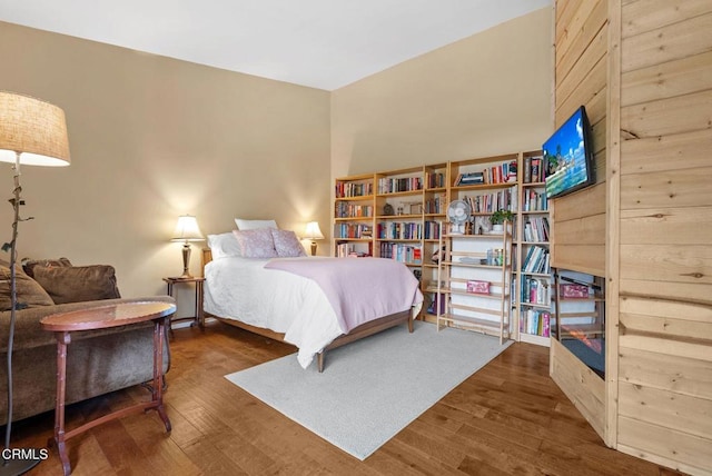 bedroom featuring wood finished floors