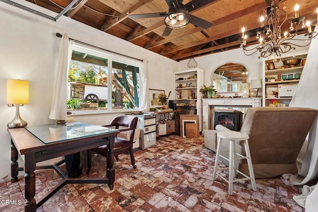 office featuring vaulted ceiling with beams, brick floor, wood ceiling, a ceiling fan, and a glass covered fireplace