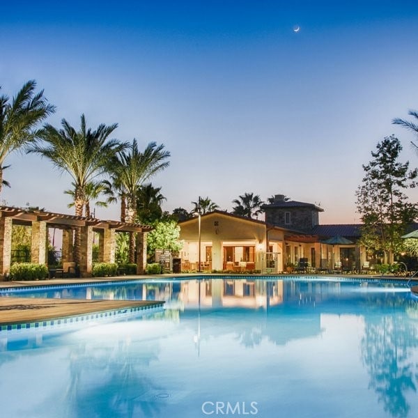 community pool featuring a pergola