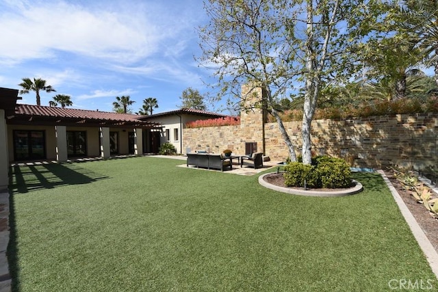 view of yard featuring fence and a patio