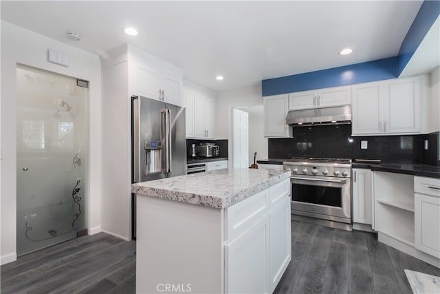 6 Bronco Ln, Bell Canyon, CA 91307 - kitchen featuring dark wood-style floors, premium appliances, under cabinet range hood, and decorative backsplash