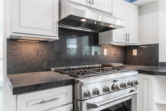 6 Bronco Ln, Bell Canyon, CA 91307 - kitchen featuring high end stainless steel range oven, decorative backsplash, white cabinets, dark countertops, and under cabinet range hood