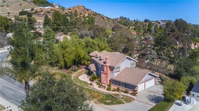 birds eye view of property with a mountain view