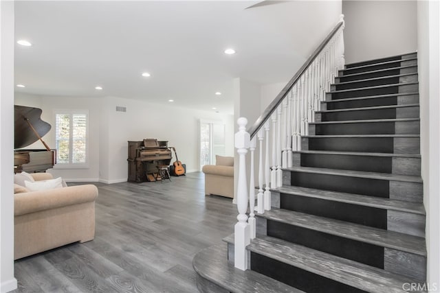 interior space with recessed lighting, visible vents, baseboards, and wood finished floors