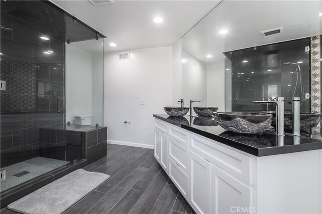 6 Bronco Ln, Bell Canyon, CA 91307 - bathroom featuring baseboards, visible vents, a stall shower, and a sink