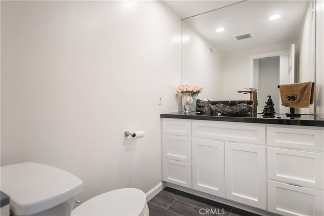 6 Bronco Ln, Bell Canyon, CA 91307 - bathroom featuring wood finished floors, toilet, vanity, baseboards, and visible vents