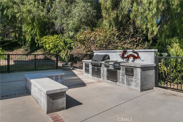 view of patio featuring grilling area, area for grilling, and fence