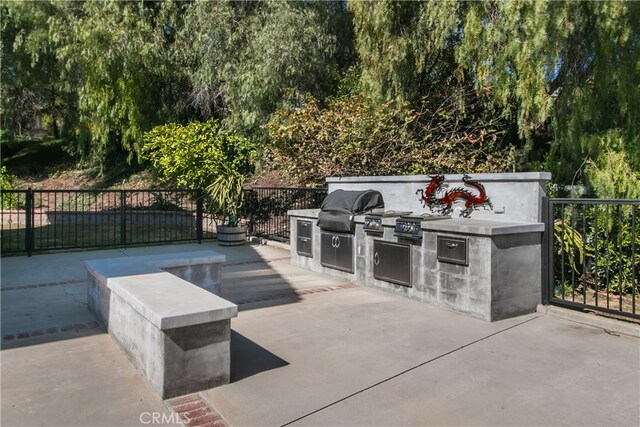 6 Bronco Ln, Bell Canyon, CA 91307 - view of patio with fence, exterior kitchen, and a grill