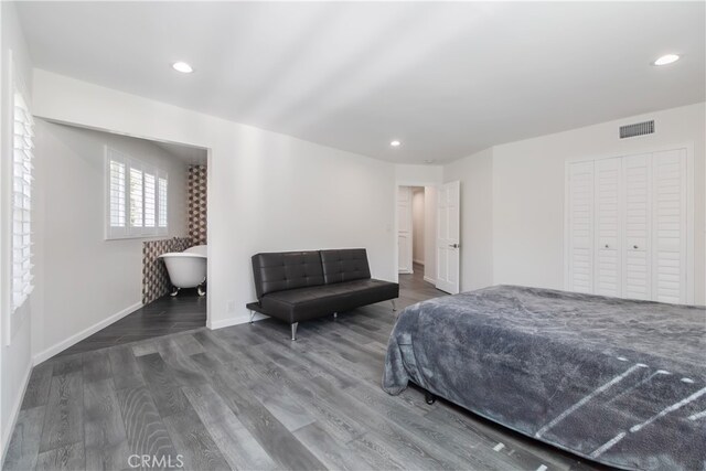 bedroom with wood finished floors, visible vents, and recessed lighting